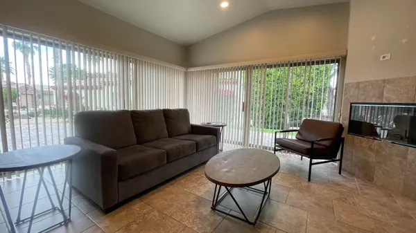 a living room with furniture and a large window