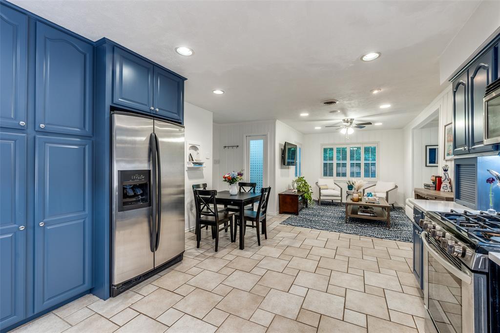 4159 Clover Lane Dallas, TX 75220 - Photo 25 of 25 Kitchen featuring appliances with stainless steel finishes, blue cabinets, recessed lighting, a ceiling fan, and open floor plan