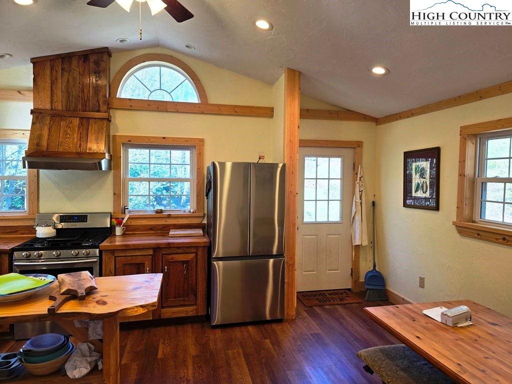 115 Little Horse Path Lansing, NC 28643 - Photo 13 of 33 a kitchen with a refrigerator and a stove top oven