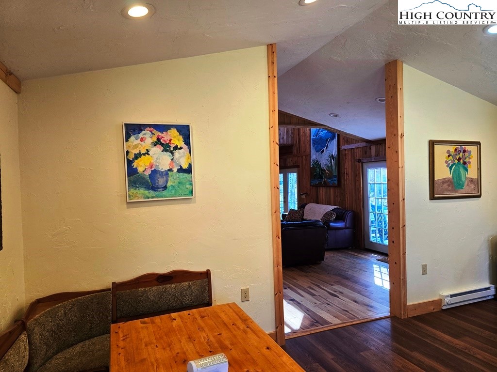 115 Little Horse Path Lansing, NC 28643 - Photo 14 of 33 a living room with furniture and wooden floor