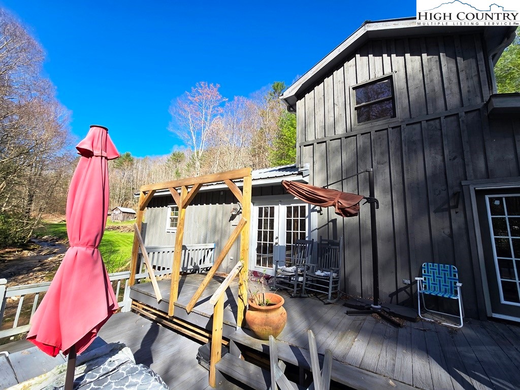 115 Little Horse Path Lansing, NC 28643 - Photo 25 of 33 a view of a house with a patio