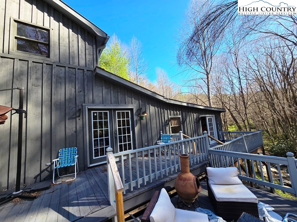 115 Little Horse Path Lansing, NC 28643 - Photo 26 of 33 a view of a chair and table in the balcony