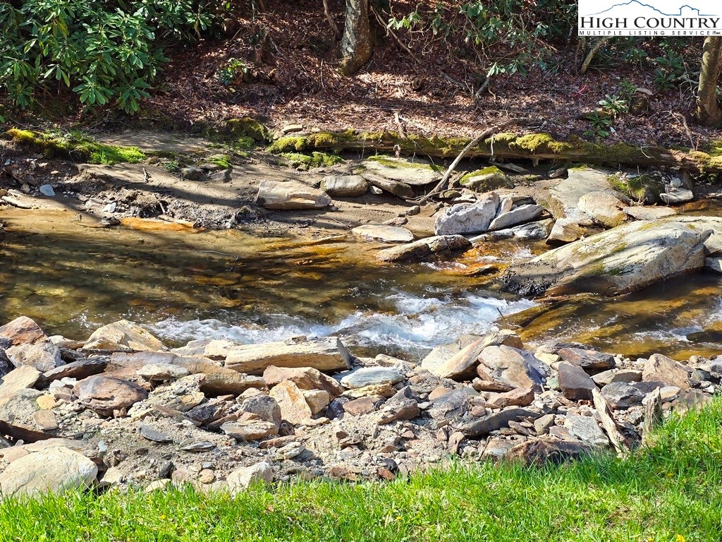 115 Little Horse Path Lansing, NC 28643 - Photo 5 of 33 a view of a tree with lots of green space