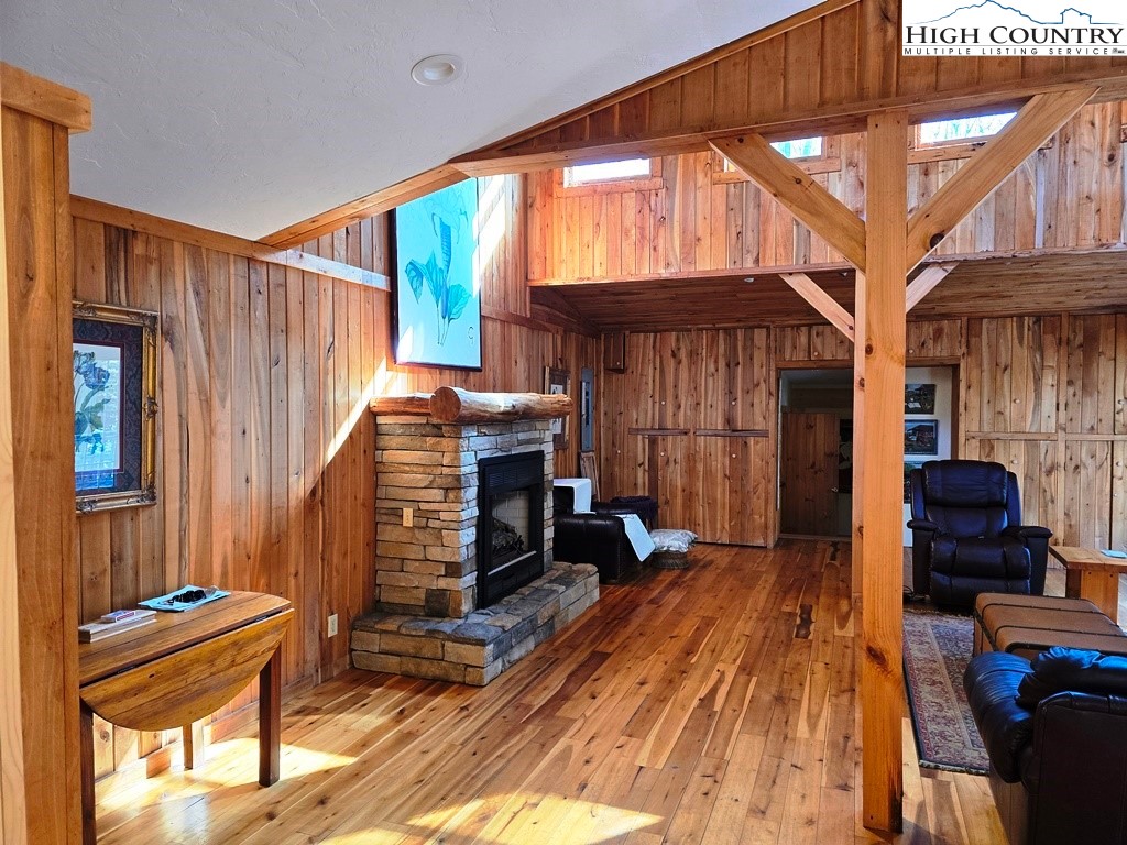 115 Little Horse Path Lansing, NC 28643 - Photo 7 of 33 a view of a balcony with chairs and wooden floor