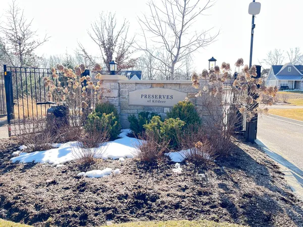 a view of a garden with a building