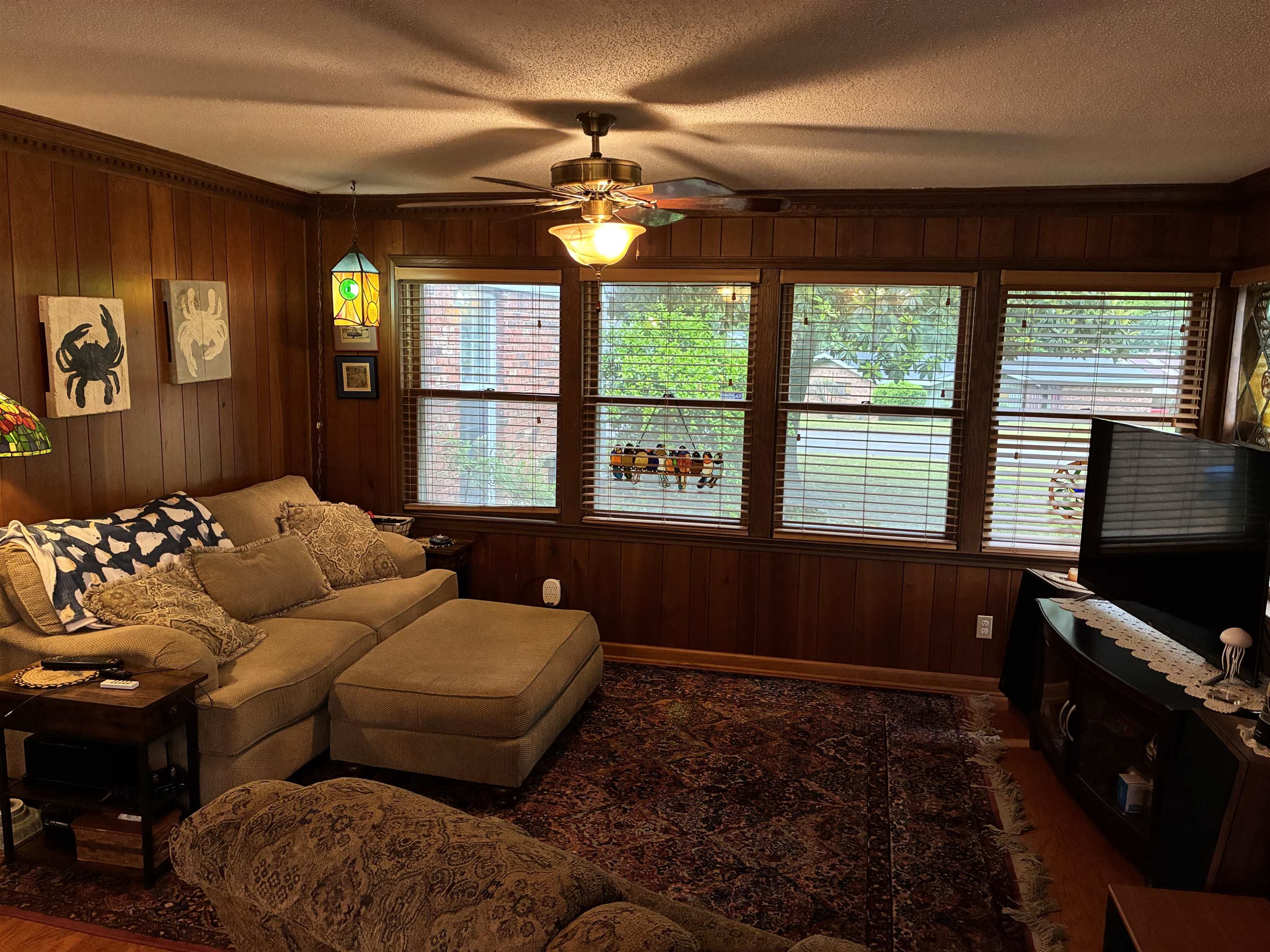 3194 Lammermuir Road Memphis, TN 38128 - Photo 14 of 40 Wood paneling and crown molding accent this space with multiple windows