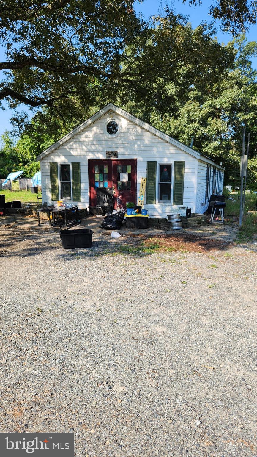 4499 Leonardtown Road Waldorf, MD 20601 - Photo 5 of 11 a view of a house with a patio and a yard