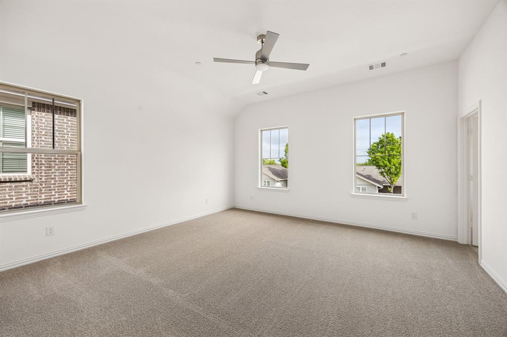 218 Dylan Way Midlothian, TX 76065 - Photo 15 of 15 A spacious owner's suite that offers high ceilings, natural light from multiple windows, his & hers walk in closets....our Hansen floor plan has it all!