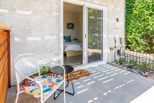 a dining table with a potted plant on it
