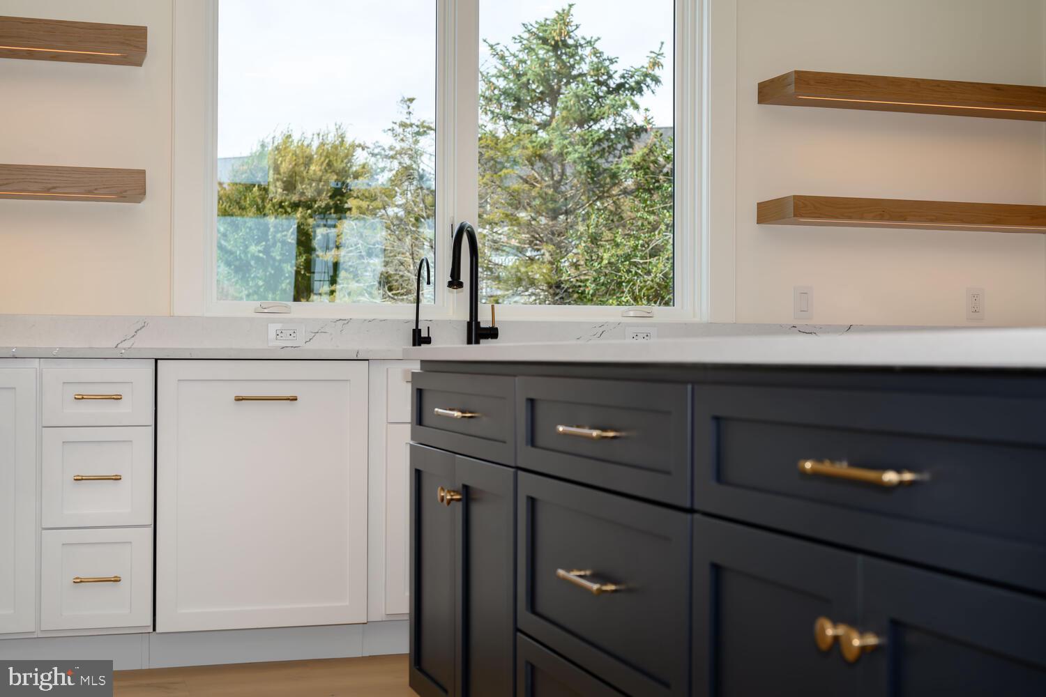 21485 Island Club Road Tilghman, MD 21671 - Photo 16 of 83 a kitchen with a sink and a window