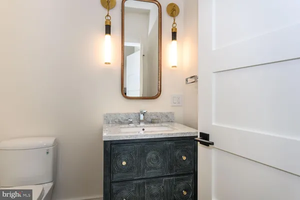 a spacious bathroom with a sink mirror and a bathtub