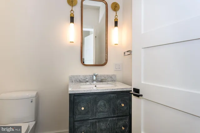 a spacious bathroom with a sink mirror and a bathtub