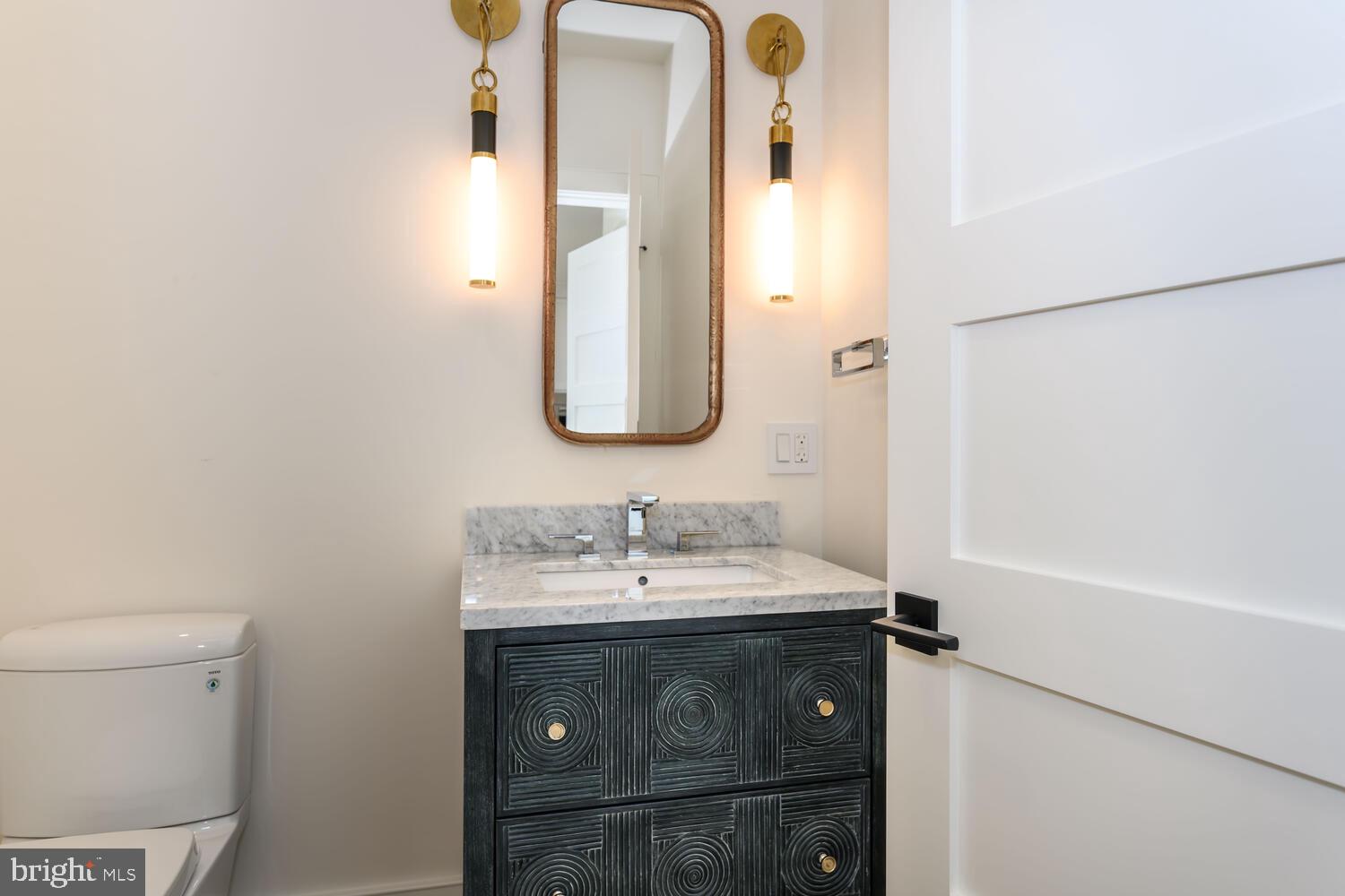 21485 Island Club Road Tilghman, MD 21671 - Photo 18 of 83 a bathroom with a sink and a mirror