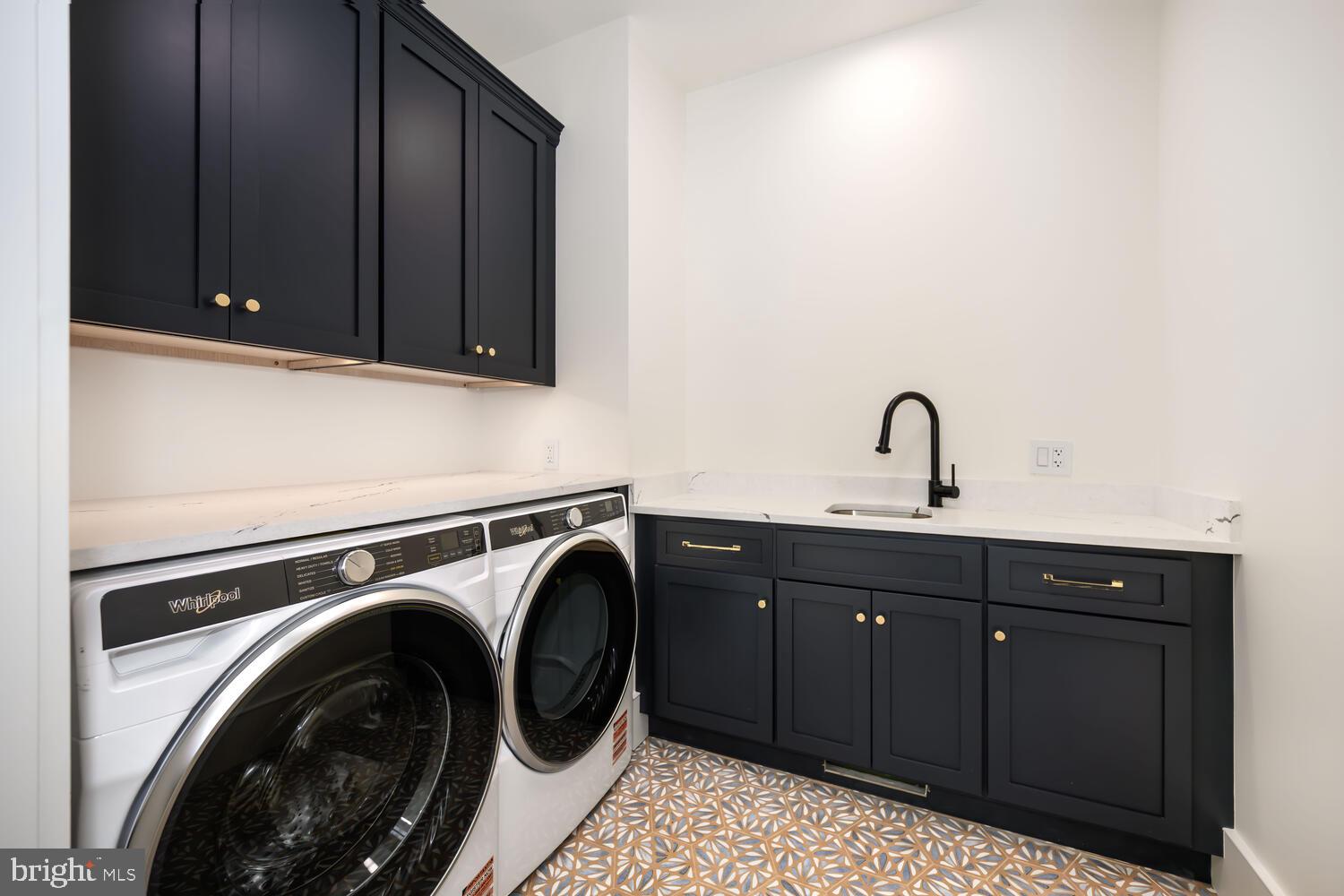 21485 Island Club Road Tilghman, MD 21671 - Photo 20 of 83 a utility room with sink dryer and washer