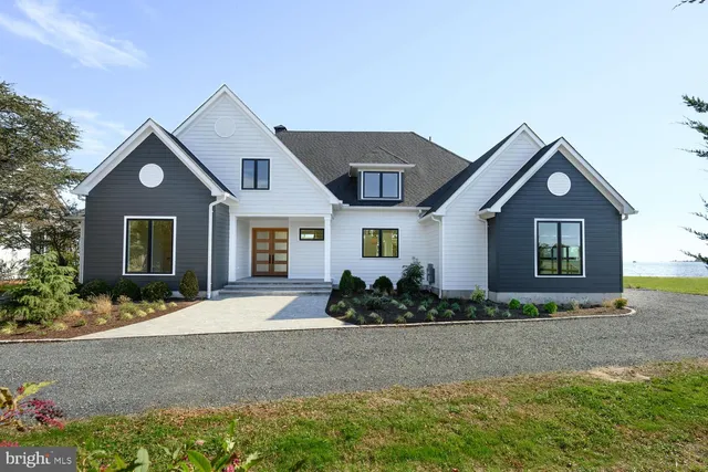 a view of a brick house with large windows
