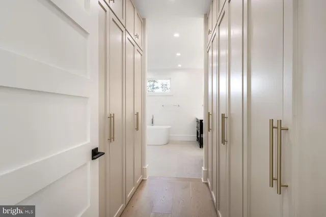 a bathroom with a double vanity sink mirror and shower