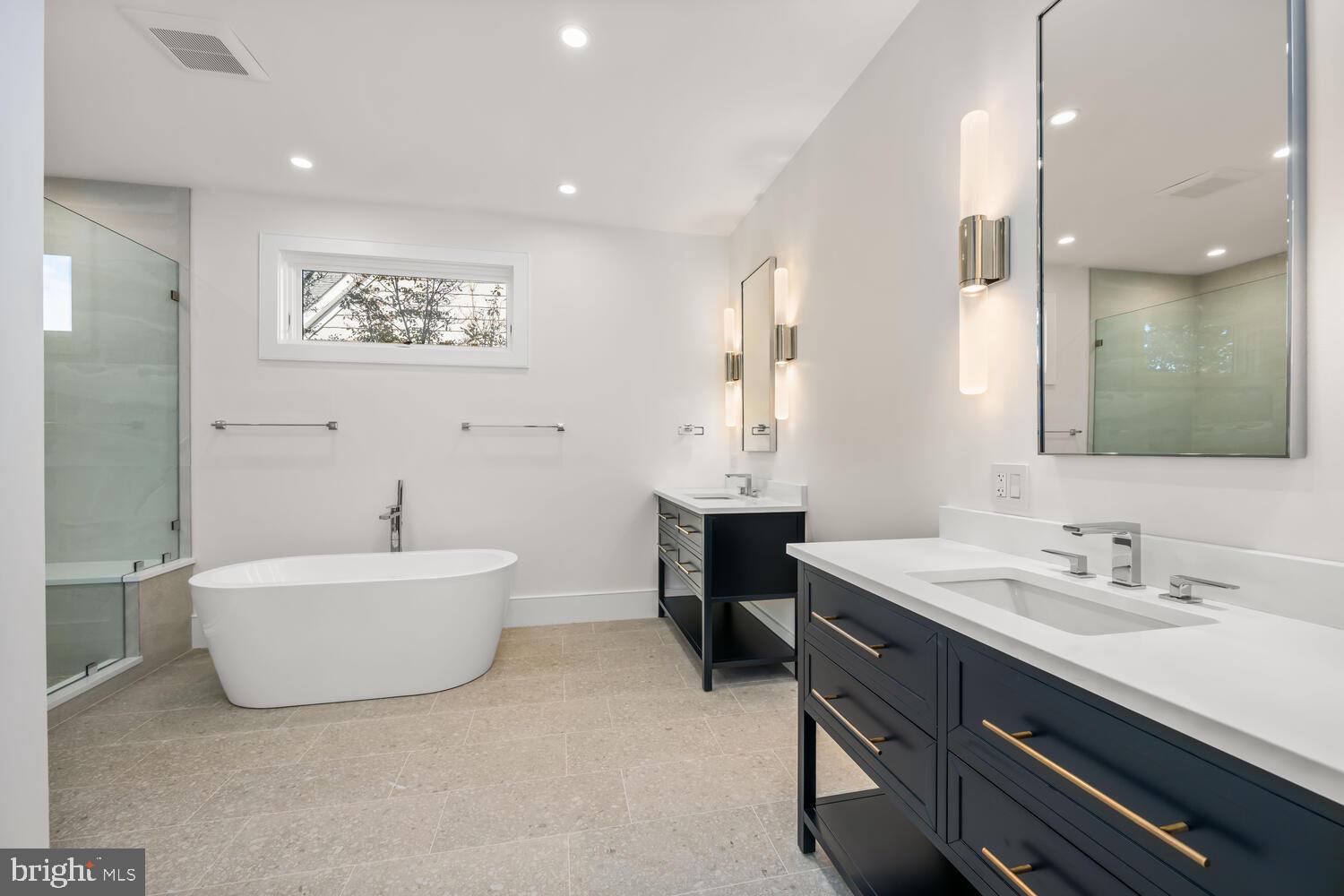 21485 Island Club Road Tilghman, MD 21671 - Photo 31 of 83 a spacious bathroom with a sink mirror and a bathtub