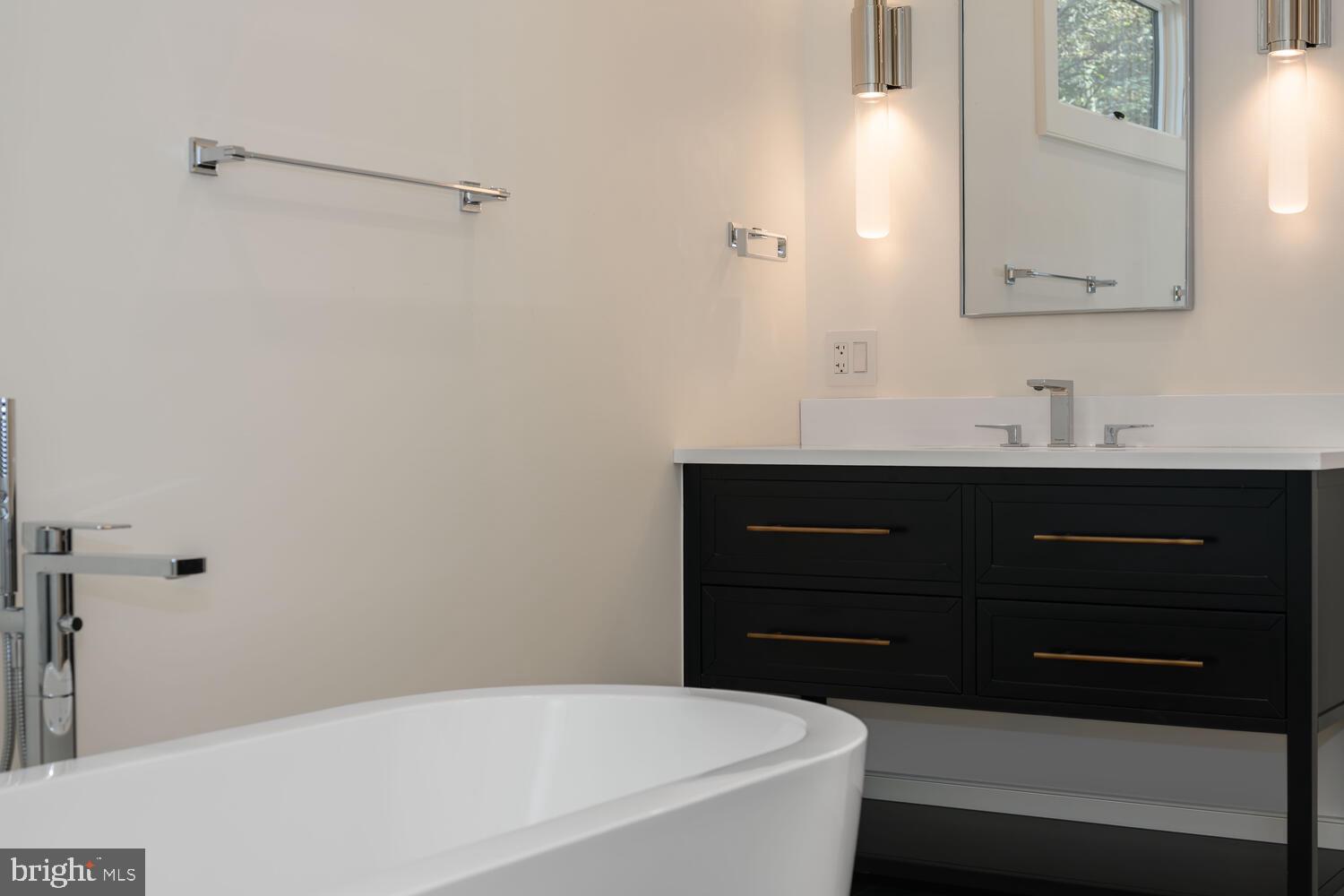 21485 Island Club Road Tilghman, MD 21671 - Photo 32 of 83 a bathroom with a sink and a mirror