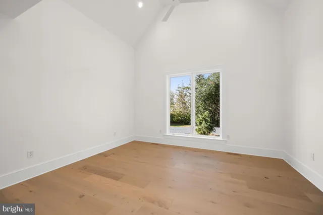 a bathroom with a double vanity sink a mirror and a bathtub