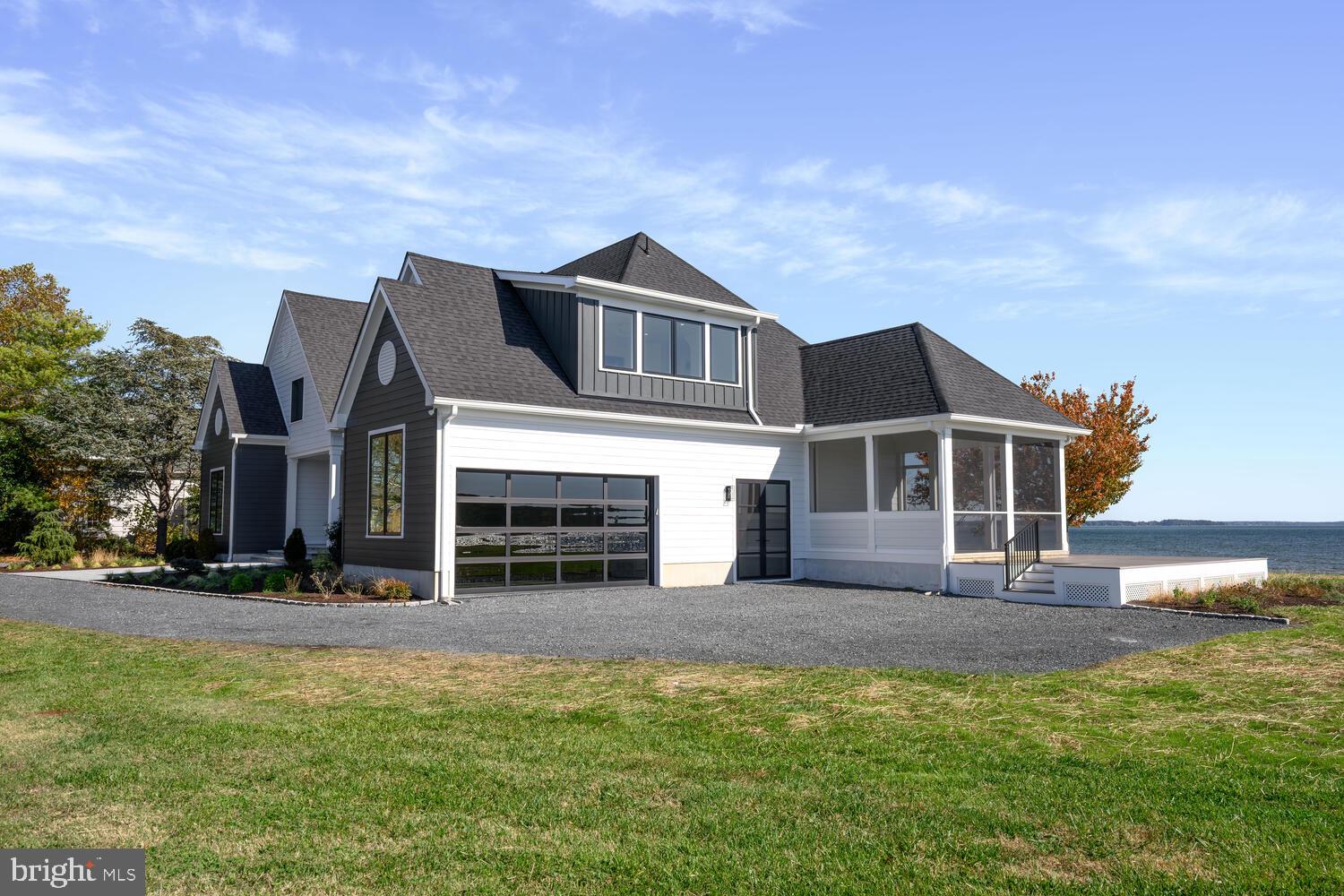 21485 Island Club Road Tilghman, MD 21671 - Photo 4 of 83 a front view of a house with a yard