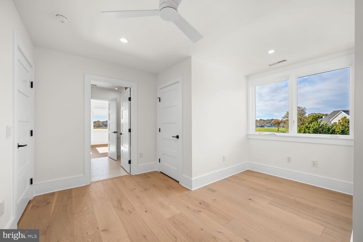 21485 Island Club Road Tilghman, MD 21671 - Photo 42 of 83 a view of empty room with wooden floor and fan