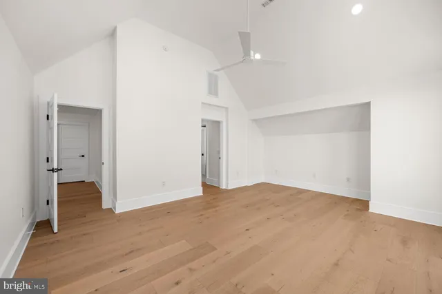 a view of a lake with boats and trees in the background