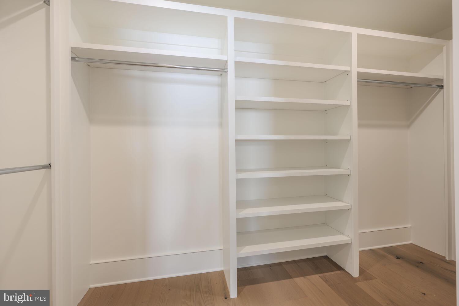 21485 Island Club Road Tilghman, MD 21671 - Photo 56 of 83 a view of walk in closet with empty racks
