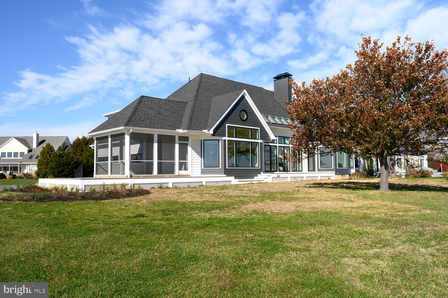 21485 Island Club Road Tilghman, MD 21671 - Photo 64 of 83 a front view of a house with a yard