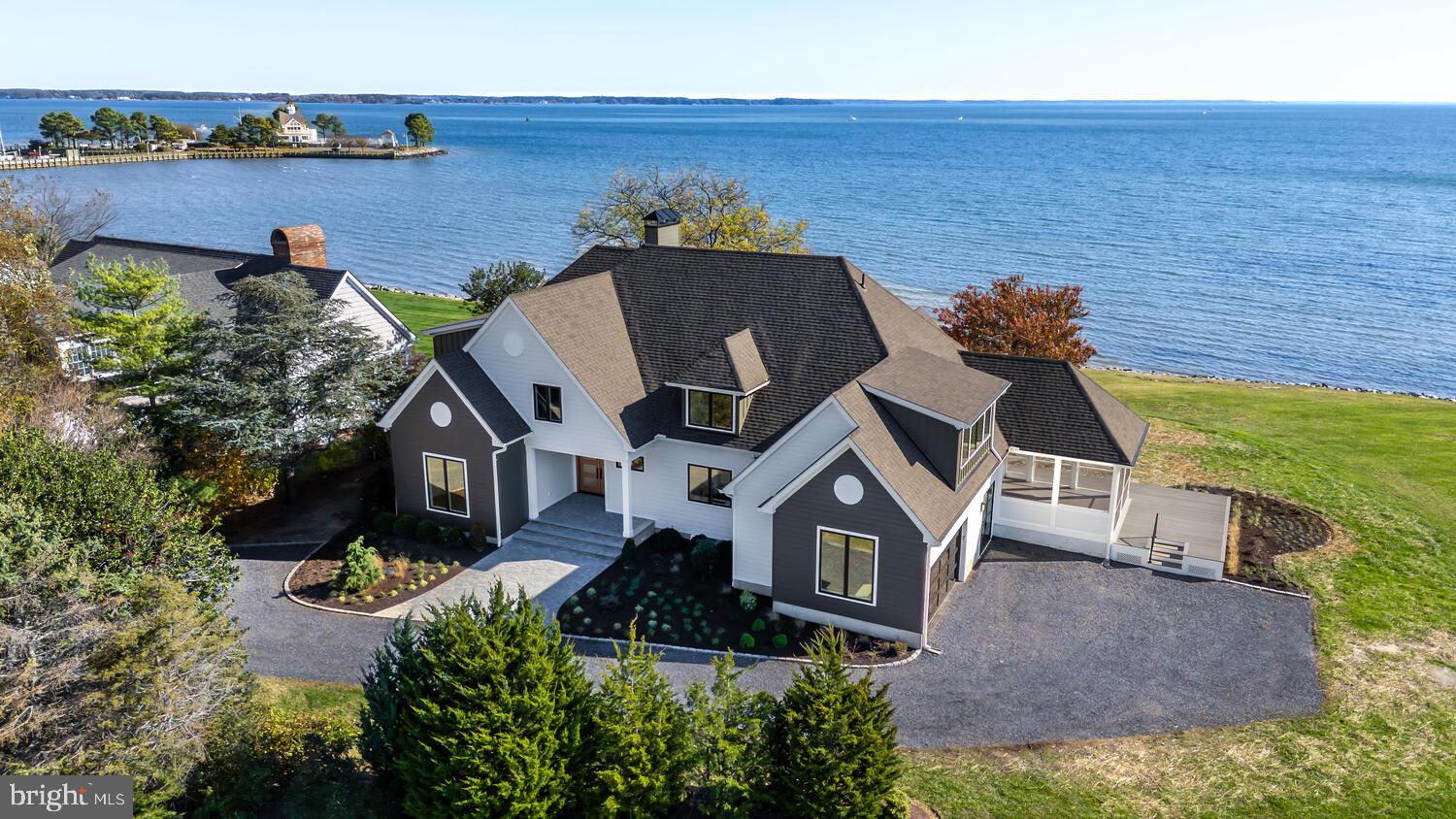 21485 Island Club Road Tilghman, MD 21671 - Photo 70 of 83 an aerial view of a house with a yard