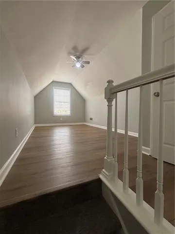 a view of room with window and ceiling fan