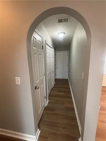 a white stove top oven sitting inside of a kitchen