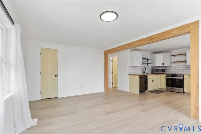 a view of kitchen with wooden floor