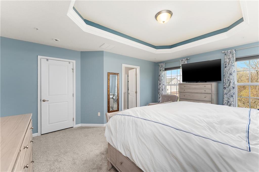 1203 Pointe View Drive Mars, PA 16046 - Photo 24 of 50 a bedroom with a bed and a flat tv screen on wall