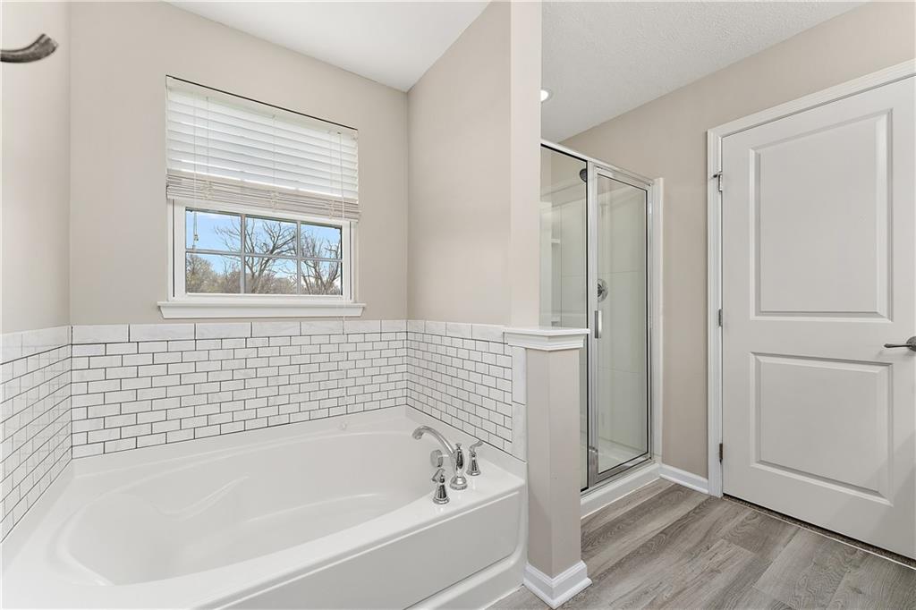 1203 Pointe View Drive Mars, PA 16046 - Photo 27 of 50 a white bath tub sitting next to a window