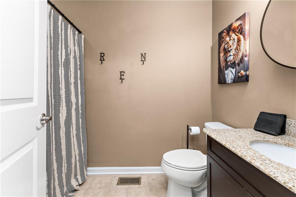 1203 Pointe View Drive Mars, PA 16046 - Photo 33 of 50 a bathroom with a granite countertop toilet and a sink