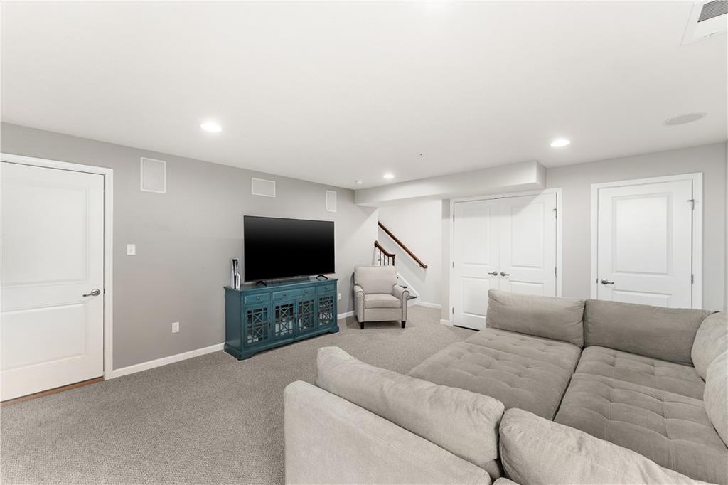 1203 Pointe View Drive Mars, PA 16046 - Photo 37 of 50 a living room with furniture and a flat screen tv