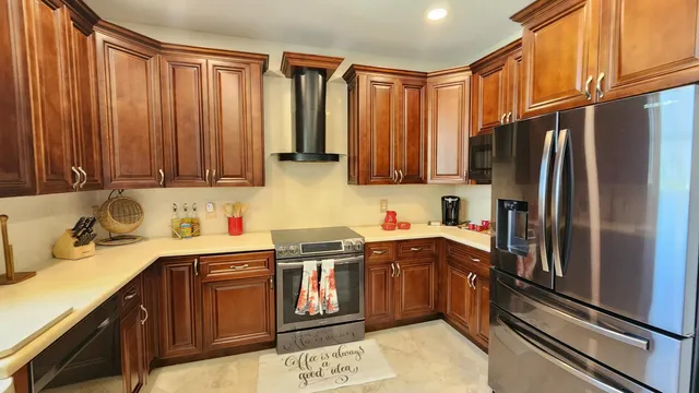 a dining room with furniture and a kitchen view