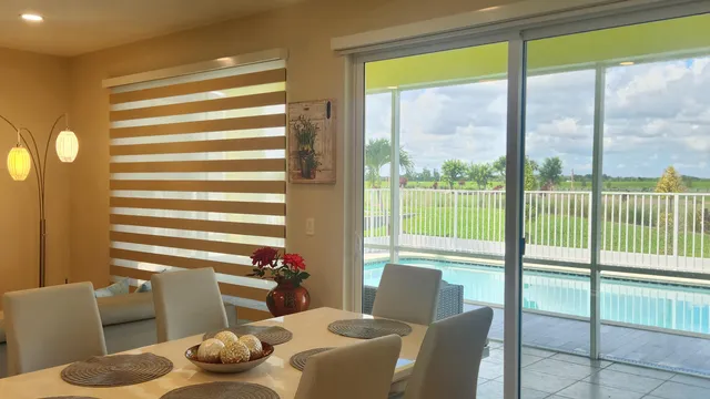 a bathroom with a large tub a shower and view