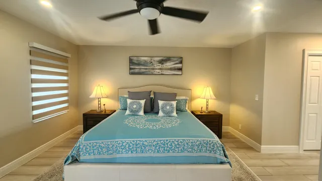 a bathroom with sink a mirror and a window