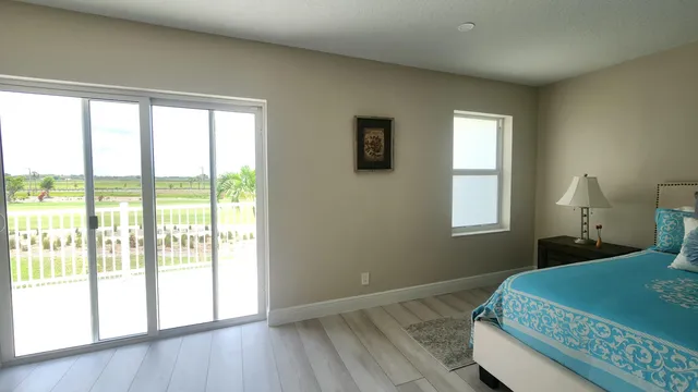 a bed room with a bed and a window