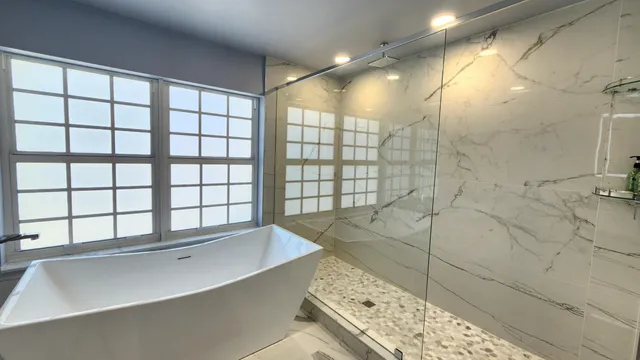 a bathroom with a sink a mirror and next to a window