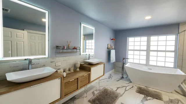 a bedroom with furniture and a window