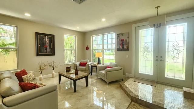 a living room with furniture and a large window