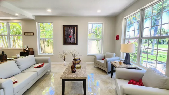 a kitchen with stainless steel appliances granite countertop a refrigerator sink and cabinets
