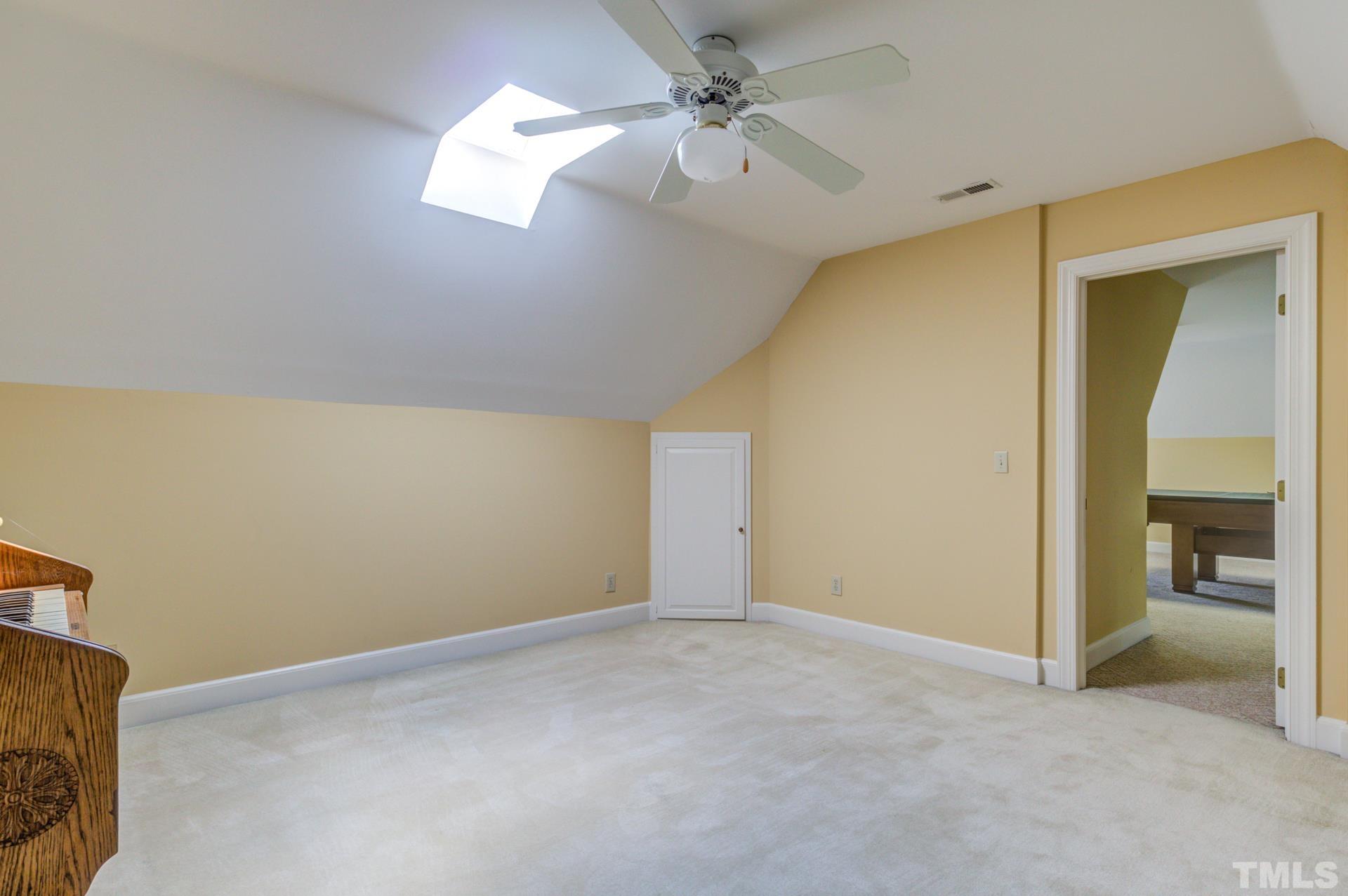 1900 Lizard Lick Road Zebulon, NC 27597 - Photo 52 of 84 a view of an empty room with a ceiling fan