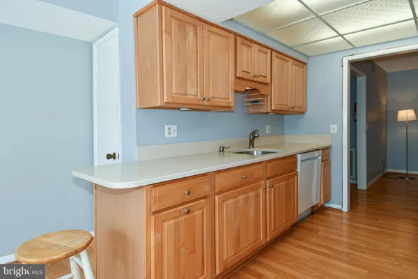 a kitchen with stainless steel appliances granite countertop a sink and cabinets