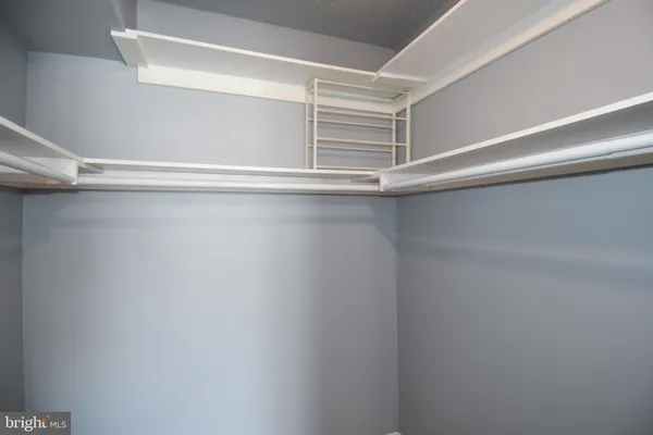 a view of an empty walk in closet