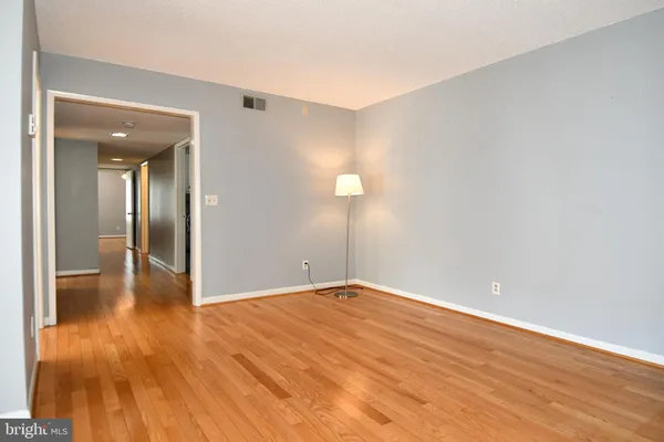 a view of an empty room and glass door