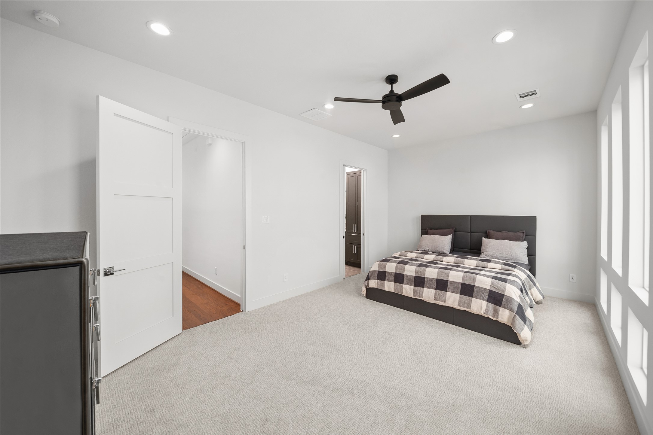 2408 Gray Street Houston, TX 77003 - Photo 8 of 23 a bedroom with a bed and cabinets