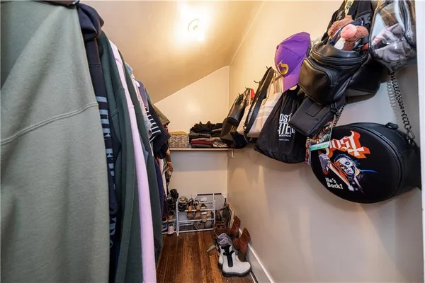 a view of a closet with storage and bicycles